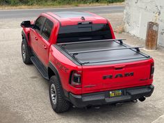 a red ram truck parked in a parking lot