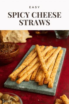 easy spicy cheese straws on a plate with dipping sauce in the background and text overlay that says easy spicy cheese straws