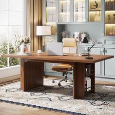 a desk with a laptop on it in front of a bookcase and window sill