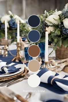 the table is set with blue and white plates, napkins, candles, and flowers