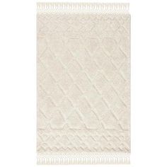 a white rug with fringes on it