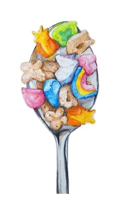 a spoon filled with lots of different types of candies on top of each other