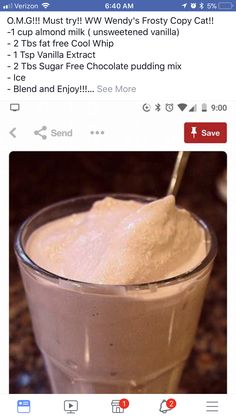 a cup filled with ice cream sitting on top of a table