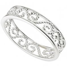 a white gold ring with filigrees and hearts on the inside, set in 18k white gold