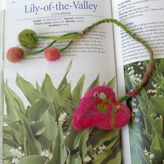 the book is open to show an image of flowers and leaves