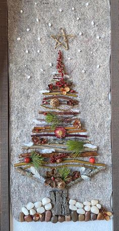 a christmas tree made out of rocks and stones