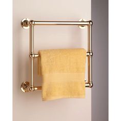 a gold towel rack with two towels hanging from it's sides and an orange towel on the other side