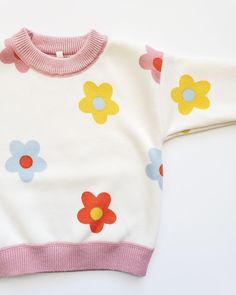 The most darling girly sweater for your little babe. Processing Time: 15-20 business days. Cute Spring Sweater For Playtime, Cute Cotton Soft Knit Sweater, Playful Crew Neck Sweatshirt For Spring, Playful Crew Neck Tops For Playdate, Cute Long Sleeve Tops For Playdate, Soft Knit Sweater For Playtime In Fall, Soft Knit Long Sleeve Sweater For Playtime, Playful White Sweater For Fall, Playful Long Sleeve Sweatshirt For Spring