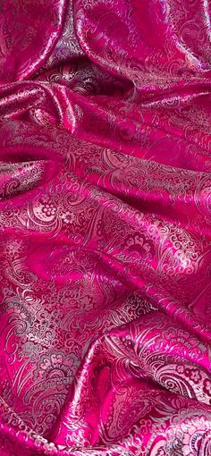 the fabric is shiny and bright pink