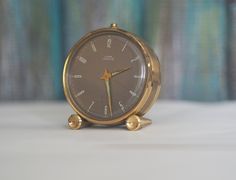 an alarm clock sitting on top of a table