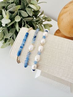 Treat yourself to a touch of luxury with our hand beaded bracelet set. Crafted with care and attention to detail, this bracelet  set boasts a stunning mix of gold filled beads, genuine fresh water pearls, and beautiful blue Aventurine gemstones. Perfect for adding a pop of color and sophistication to any outfit. Details: Bracelet 1: 3mm gold filled beads and Aventurine gemstones  Bracelet 2: Mix of Fresh water pearls and  3mm Aventurine gemstones Bracelet 3: Fresh water pearl focal bead and 3mm Aventurine Bracelet, Pearl Beaded Bracelet, Blue Aventurine, Handmade Silver Jewellery, Beads Bracelet Design, Beaded Jewelry Designs, Fresh Water Pearls, Beaded Bracelets Diy, Water Pearls