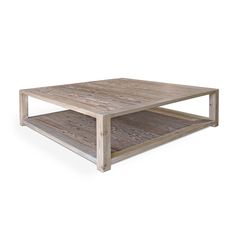 a wooden coffee table sitting on top of a white floor