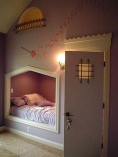 a bedroom with a bed in the corner and a mirror on the wall above it