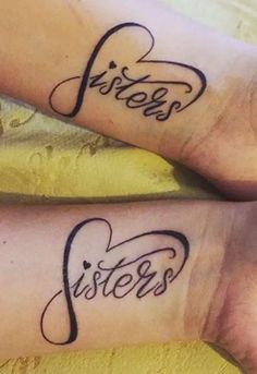 two people with matching tattoos on their legs, one has the word sisters written in cursive writing