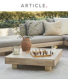 a coffee table with chess pieces on it