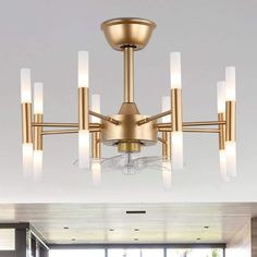 a chandelier that is hanging from the ceiling in a room with white walls