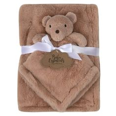 a teddy bear is wrapped in a blanket