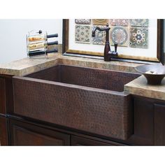 a kitchen sink that is brown in color