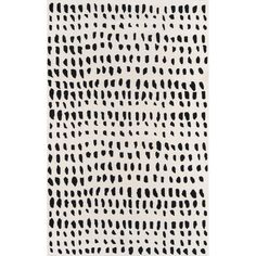 a black and white rug with dots on it