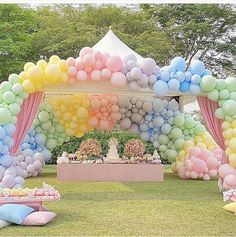 an outdoor party with balloons and decorations