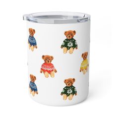 a white mug with brown teddy bears wearing sweaters on the front and sides, all printed with flowers