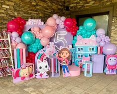 there are balloons and decorations on the wall for children's birthdays at this house