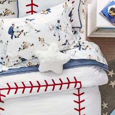 baseball themed bedding and pillows in a child's bedroom