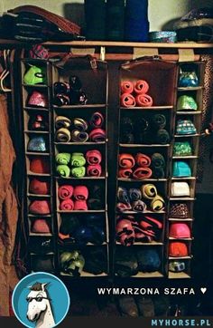 there is a large rack with many pairs of shoes