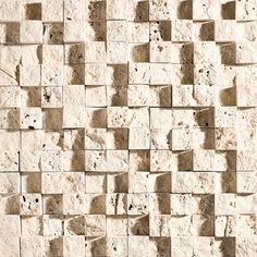 a close up view of a wall made out of small squares and rectangles