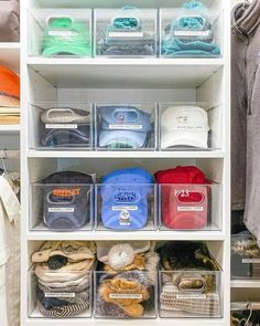 an organized closet with clear bins filled with items