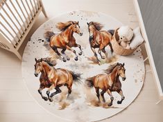 four brown horses running on the floor next to a teddy bear