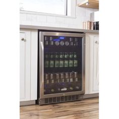 a beverage cooler in the middle of a kitchen