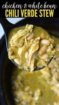 chicken and white bean chili verde stew in a black bowl with a spoon