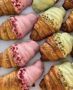 there are many croissants with different toppings on them