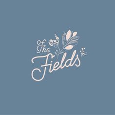 the field logo on a blue background with white flowers and leaves in it's center