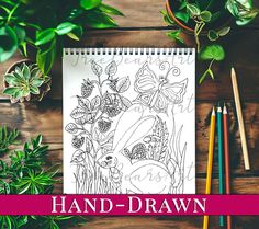 a coloring book with plants and pencils on the table next to it is an image of hand - drawn flowers