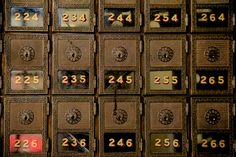 many mail boxes with numbers on them