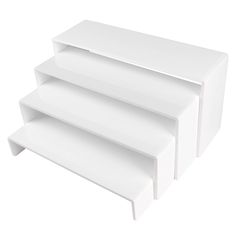 three white shelves stacked on top of each other