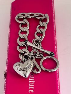 "BRAND NEW, 👑👑 100% AUTHENTIC JUICY COUTURE. IN ORIGINAL BOX 🎁   💎💎CLASSY Bracelet from the JUICY COUTURE ERA! 💎💎  👑👑VINTAGE Juicy Couture 👑👑 Starter Bracelet.  🚚Silver Plated on Brass.  🚚Measures 7.5\".  🚚Signature Puff Heart pendant.  🚚Toggle closure with crown. Box has light cosmetic damage inside but still very functional as new. See pics. WEBITEM 17DSB4" Bday Gifts, Vintage Juicy Couture, Bracelet Silver, Gifts Ideas, Heart Charm, Juicy Couture, Heart Pendant