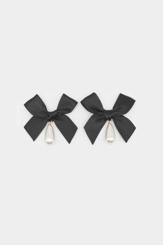 Coquette bow pearl drop earringsContent + CareDo not get wetAvoid contact with lotions and fragrances Saint Candles, Drop Pearl Earrings, Black Bows, Lori Harvey, Pearl Bow, Graphic Tee Dress, Bow Jewelry, Metal Belt, Bow Earrings