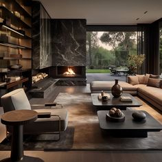 a living room with couches, tables and a fire place in the fireplace area