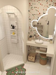 a bathroom with a mirror, sink and shower stall in the corner next to a tiled floor