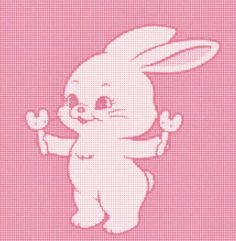 a pink cross stitch pattern with an image of a white bunny holding a carrot in it's hand