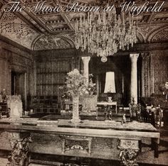 an old photo of a room with chandelier