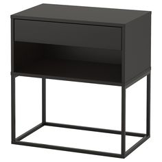 a black bedside table with one drawer on the top and two shelves below it, against a white background