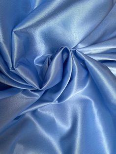 This satin fabric is a stunning shade Cinderella Blue. Approximately 55” wide, this fabric is perfect for skirts, dresses, and drapery. Will combine shipping. Fabric Content: Synthetic We do not accept returns on fabric purchases. We do offer sample swatches of all of our fabrics. Photo on the right is for inspirational purposes as it is made out of a similar fabric, but please note it is not made of the actual fabric. The actual fabric is depicted in the fabric photos. Blue Silk Fabric, Bday Dress, Cinderella Blue, Magazine Layout Design, Air Force Blue, Blue Colour Palette, Brocade Fabric, Magazine Layout, Women Helping Women