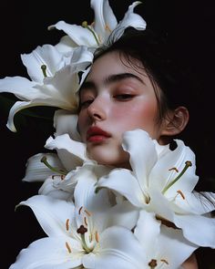 a woman with white flowers in her hair