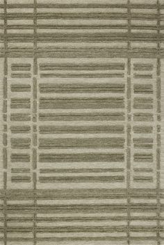 an area rug with horizontal lines in grey and light brown colors on top of it