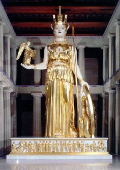 an image of a golden statue in the middle of a room