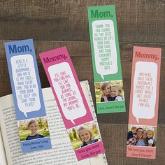 three bookmarks with different sayings on them sitting next to an open book that says mom